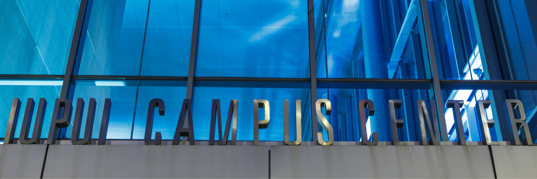 The letters above the door to the Campus Center that spell out IUPUI Campus Center.
