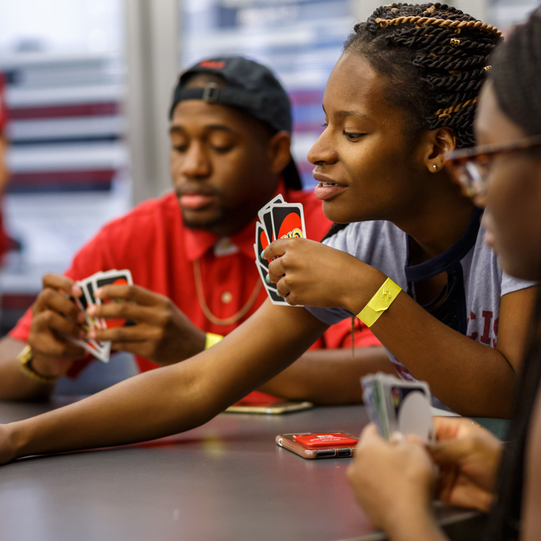 A game of Uno occuring in the cube.