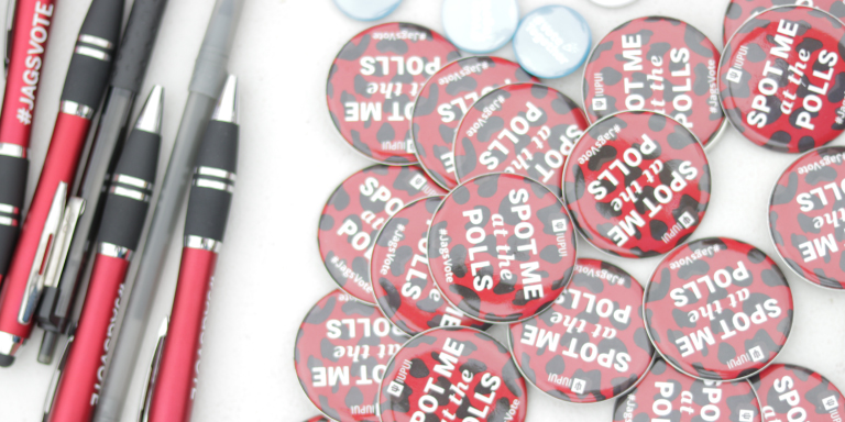 Buttons that say Meet me at the Polls with accompanying pens for give away at the March to the Polls event.