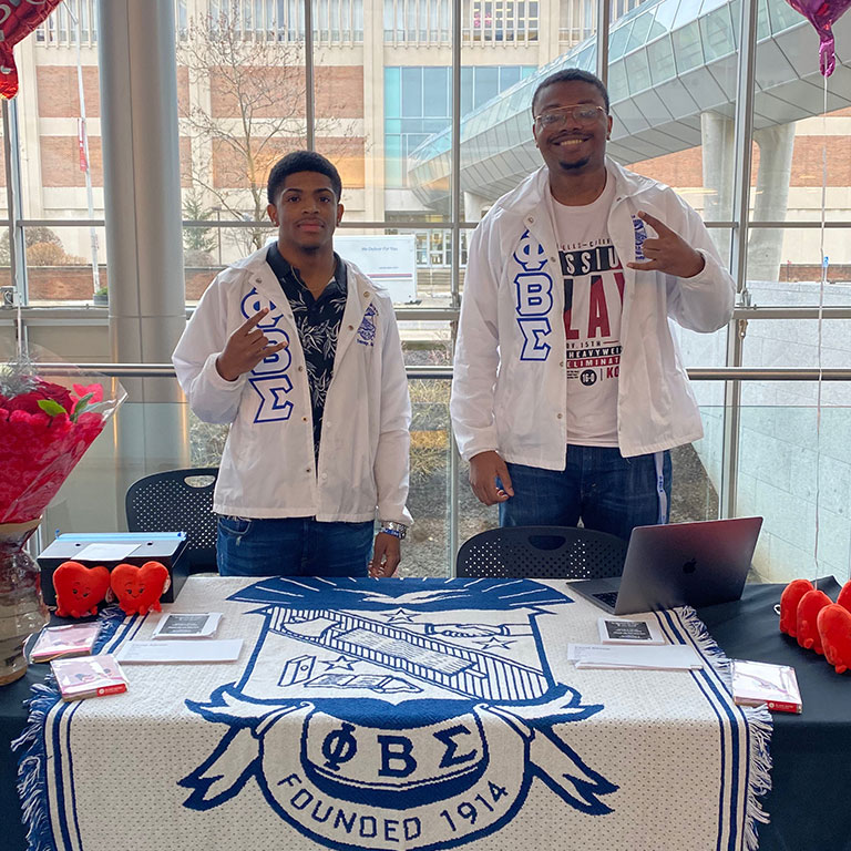 Members of Phi Beta Sigma pose for a photo together.
