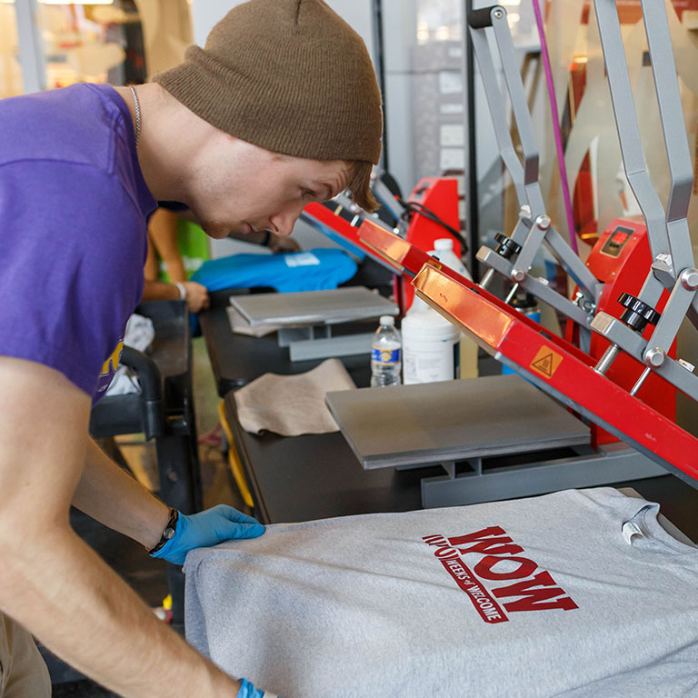 A WOW shirt being made at the shirt press.