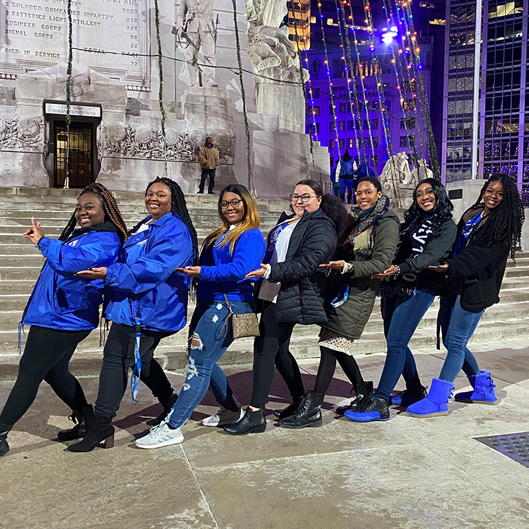Members of Zeta Phi Beta Sorority, Inc. posing for a photo on Monument Circle in Indianapolis.