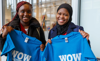 Two students posing with their weeks of welcome shirts.